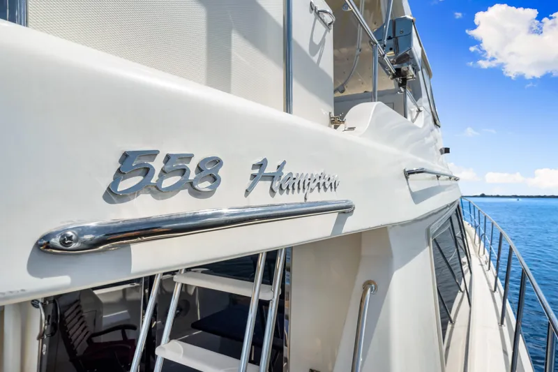 Gypsy Spirit Yacht Photos Pics 2007 Hampton 558 Pilothouse yacht on calm blue water, showcasing sleek design.