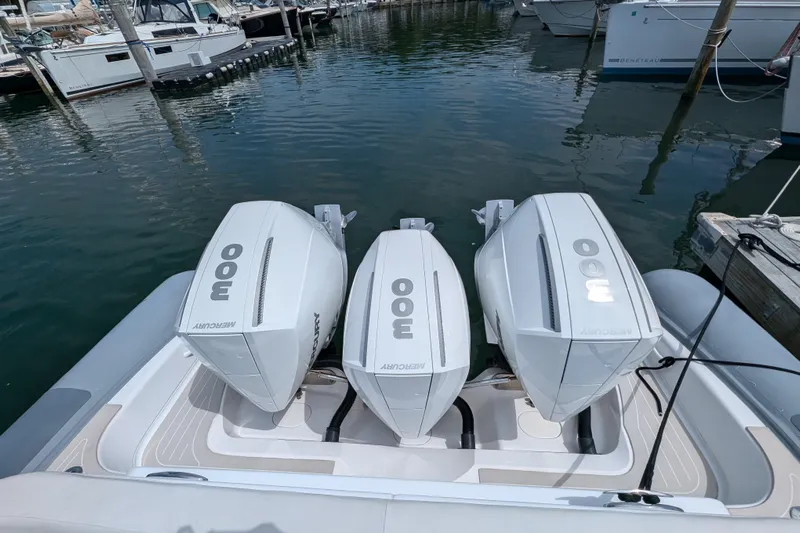 Yellowfin Yacht Photos Pics 2015 Yellowfin RIB with triple Mercury 300 engines docked at marina.