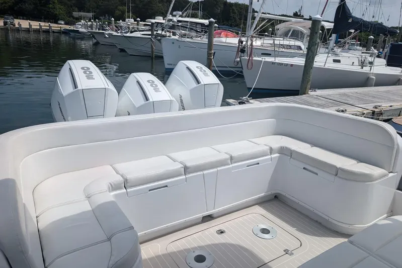 Yellowfin Yacht Photos Pics 2015 Yellowfin RIB boat with triple outboard engines docked at marina.
