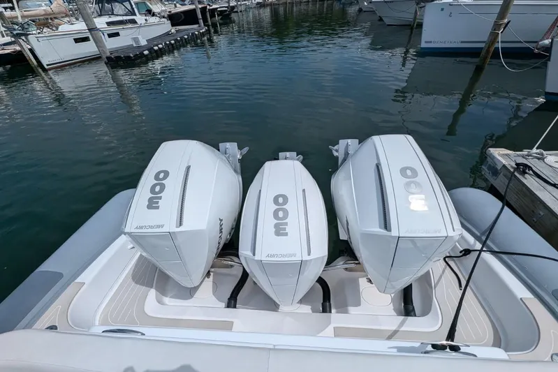 Yellowfin Yacht Photos Pics 2015 Yellowfin RIB with triple Mercury 300 engines docked at marina.