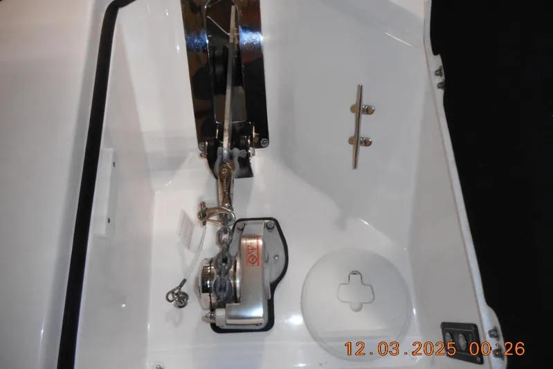  Yacht Photos Pics Anchor compartment of 2023 Sea Fox 288 Commander boat, featuring winch and cleat.
