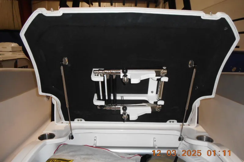  Yacht Photos Pics 2023 Sea Fox 288 Commander boat storage compartment with open lid and hydraulic supports.