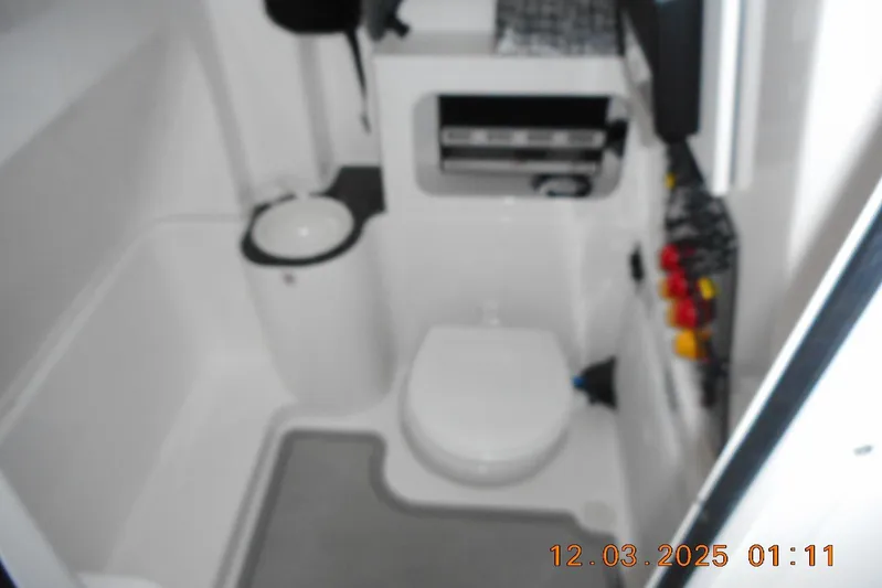  Yacht Photos Pics 2023 Sea Fox 288 Commander boat interior with compact bathroom amenities.