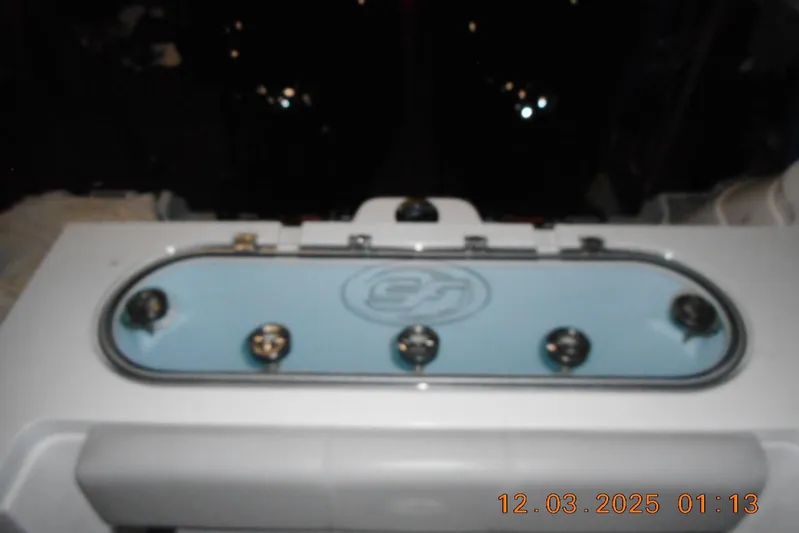  Yacht Photos Pics 2023 Sea Fox 288 Commander boat livewell with multiple latches, illuminated in low light.