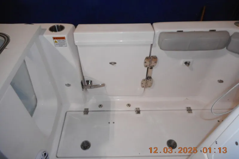  Yacht Photos Pics 2023 Sea Fox 288 Commander boat interior, featuring seating and storage compartments.