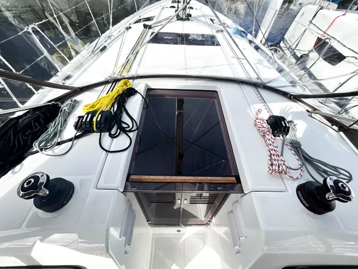 Air Guitar Yacht Photos Pics 2024 Jeanneau Sun Odyssey 440 deck with winches and ropes, showcasing sleek sailing design.