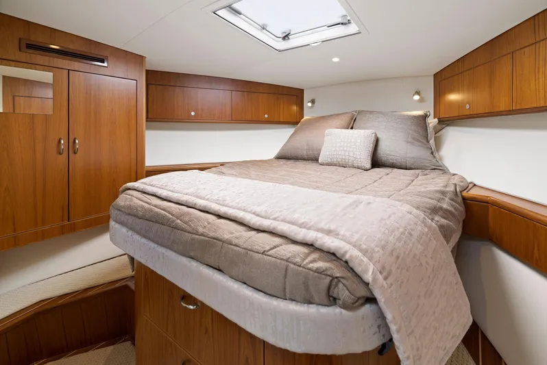 Lil Fella Yacht Photos Pics Luxurious cabin interior of 2012 Cabo 44 Hardtop Express yacht with cozy bed.
