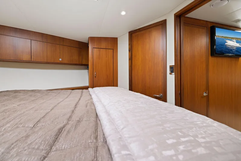 Lil Fella Yacht Photos Pics Luxurious cabin interior of 2012 Cabo 44 Hardtop Express yacht with wood finishes.