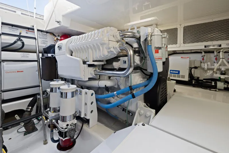 Lil Fella Yacht Photos Pics Engine room of a 2012 Cabo 44 Hardtop Express yacht.