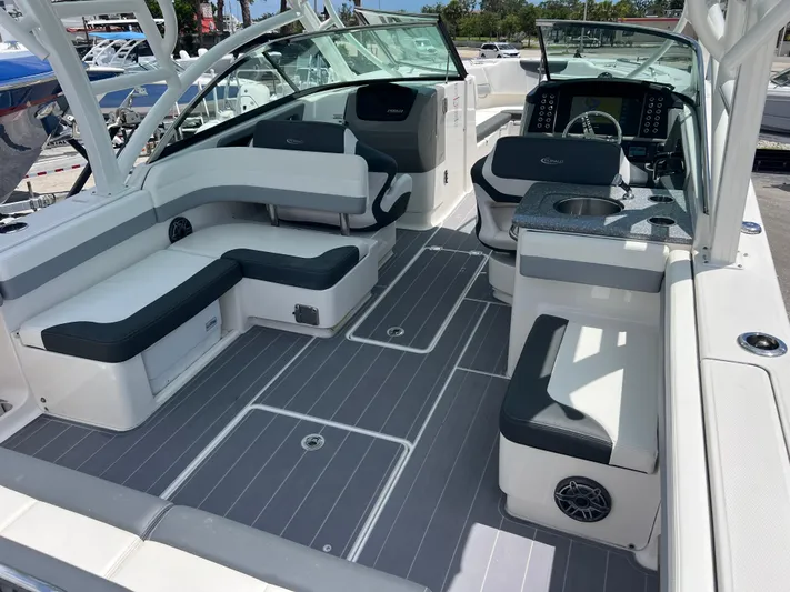  Yacht Photos Pics 2020 Robalo R317 Dual Console boat interior with spacious seating and modern dashboard.