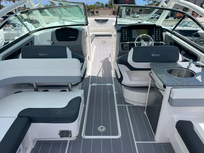  Yacht Photos Pics 2020 Robalo R317 Dual Console boat interior with seating, helm, and kitchenette.