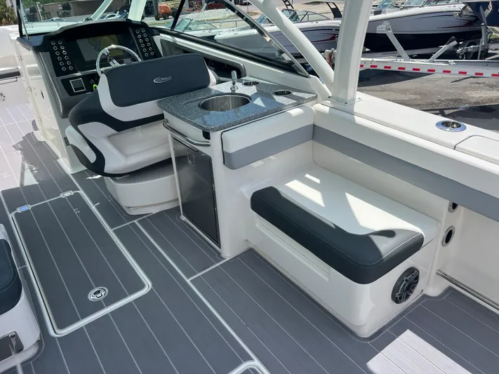  Yacht Photos Pics 2020 Robalo R317 Dual Console boat interior with seating, sink, and control panel.