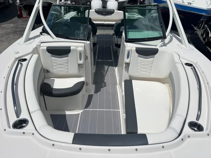  Yacht Photos Pics 2020 Robalo R317 Dual Console boat interior with white seating and gray flooring.
