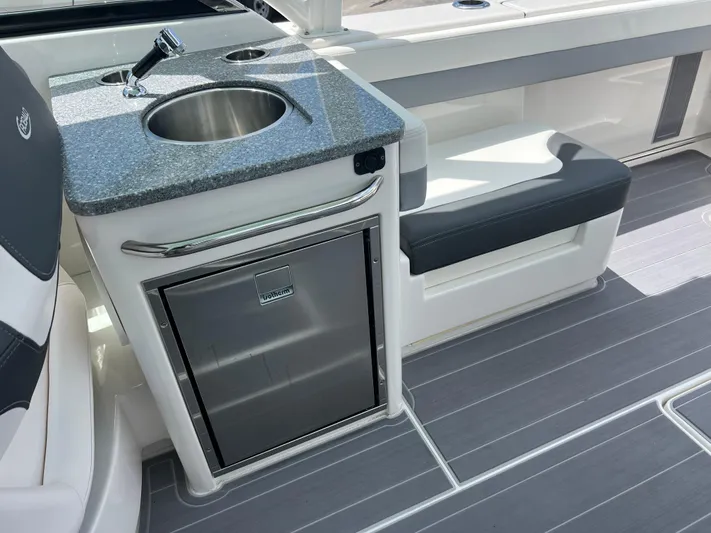  Yacht Photos Pics 2020 Robalo R317 Dual Console boat interior with sink, seating, and storage.