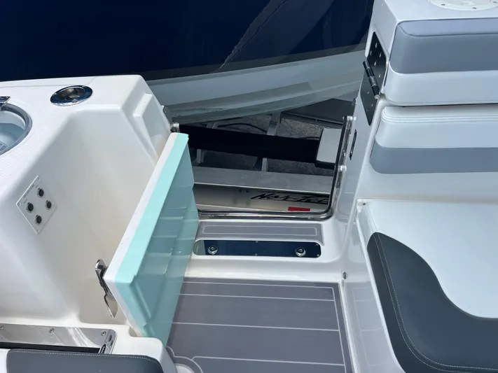  Yacht Photos Pics 2020 Robalo R317 Dual Console boat interior with open storage compartment.