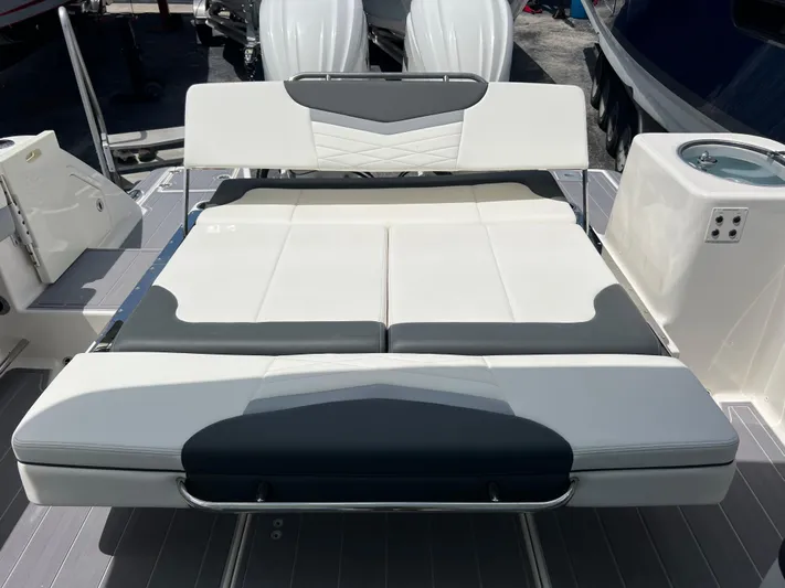  Yacht Photos Pics 2020 Robalo R317 Dual Console boat with cushioned seating and sleek design.