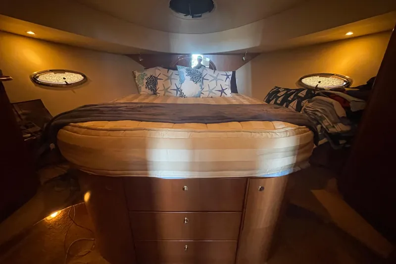 Born Free Yacht Photos Pics Luxurious bedroom interior of 2007 Silverton 38 Convertible yacht with cozy bedding.