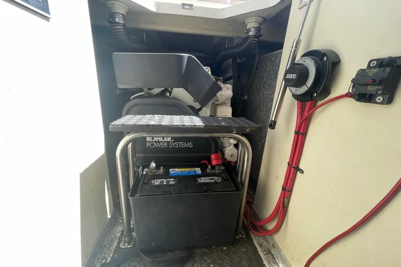 Born Free Yacht Photos Pics Engine compartment of 2007 Silverton 38 Convertible with Kohler power system and battery.
