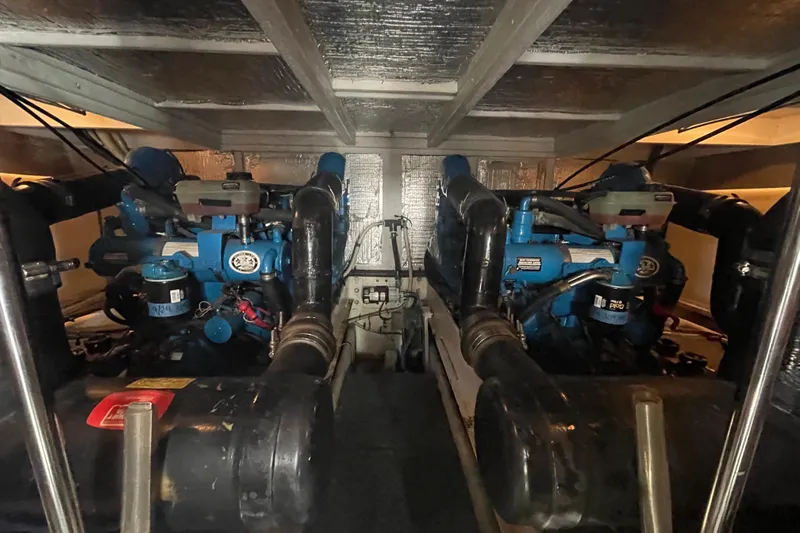 Born Free Yacht Photos Pics Engine room of a 2007 Silverton 38 Convertible boat, showcasing dual engines.