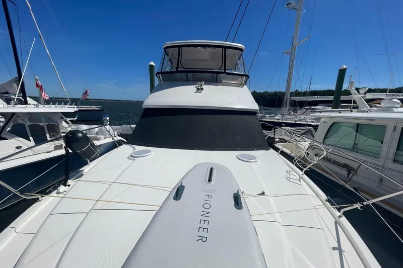 Born Free Yacht Photos Pics 2007 Silverton 38 Convertible yacht docked at marina under clear blue sky.
