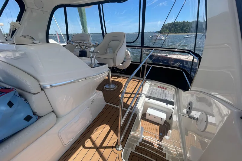 Born Free Yacht Photos Pics 2007 Silverton 38 Convertible yacht interior with helm, seating, and ocean view.