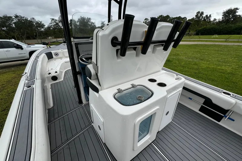  Yacht Photos Pics 2023 Tidewater 2700 Carolina Bay boat interior with rod holders and livewell.