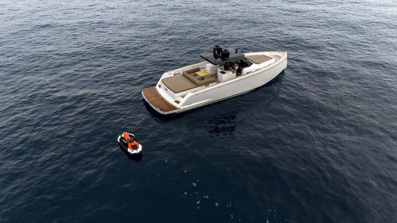  Yacht Photos Pics 2024 Pardo Yachts P50 on open water with a nearby jet ski.