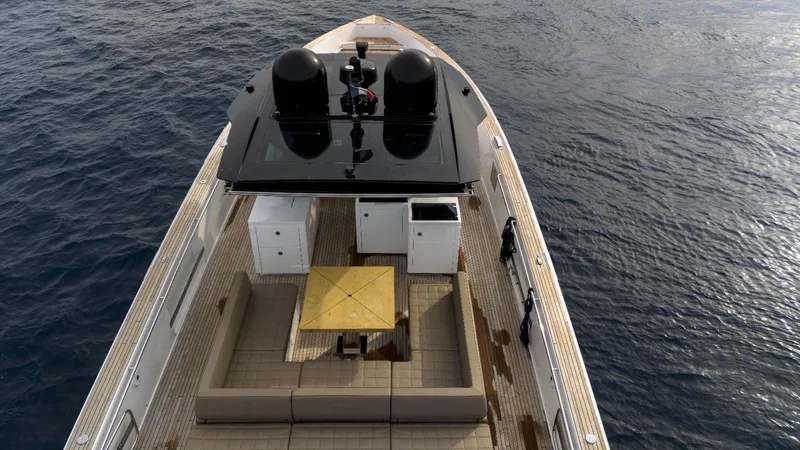  Yacht Photos Pics 2024 Pardo Yachts P50 luxury deck with seating and table, overlooking the ocean.