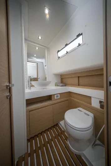  Yacht Photos Pics Luxurious bathroom interior of 2024 Pardo Yachts P50, featuring modern fixtures and wooden accents.