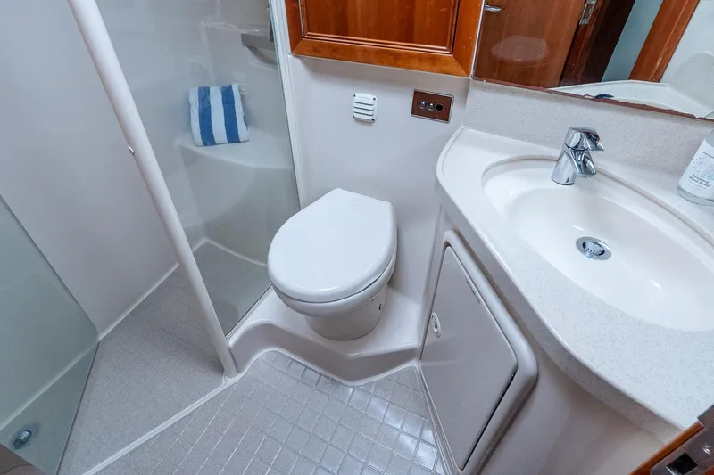 Chillax Yacht Photos Pics Luxurious bathroom in 2005 Riviera 51 Flybridge yacht with modern fixtures.