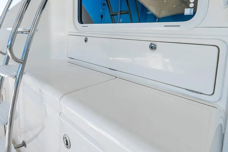 Chillax Yacht Photos Pics 2005 Riviera 51 Flybridge yacht detail with sleek white exterior and stainless steel ladder.