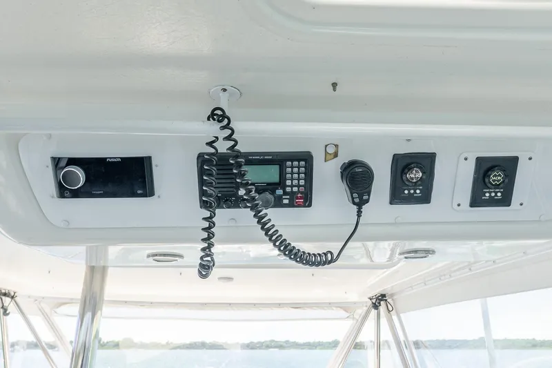 Chillax Yacht Photos Pics Control panel of a 2005 Riviera 51 Flybridge yacht with communication equipment.