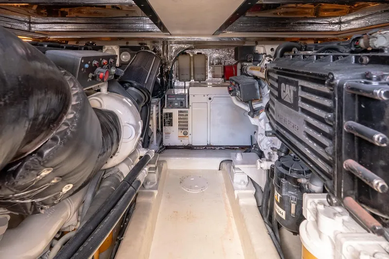 Chillax Yacht Photos Pics Engine room of 2005 Riviera 51 Flybridge with CAT marine power system.