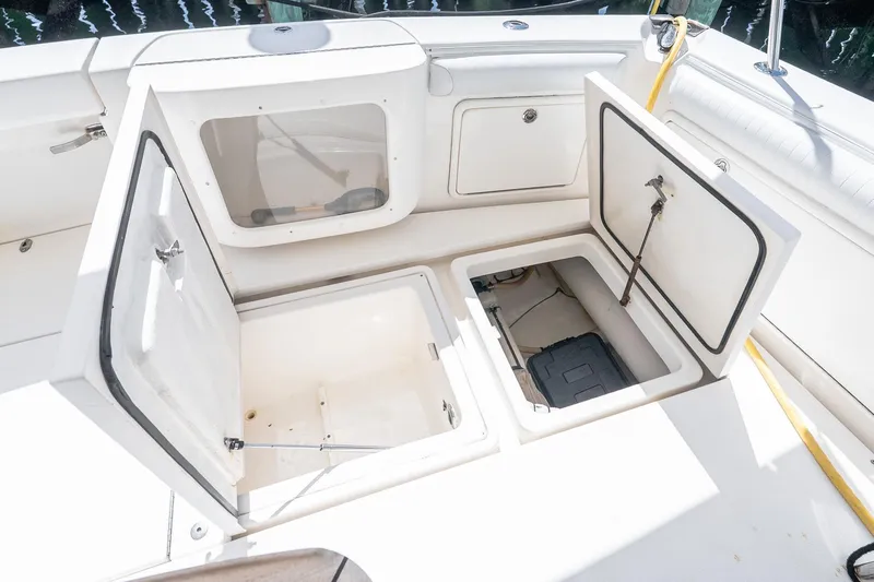 Chillax Yacht Photos Pics 2005 Riviera 51 Flybridge storage compartments open on deck.