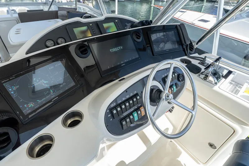 Chillax Yacht Photos Pics 2005 Riviera 51 Flybridge helm with advanced navigation and control systems.