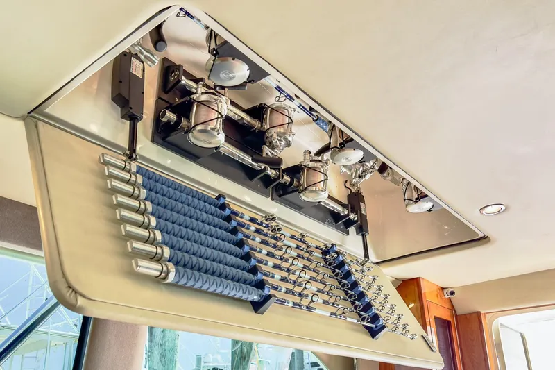 Chillax Yacht Photos Pics Interior view of 2005 Riviera 51 Flybridge with fishing rod storage.