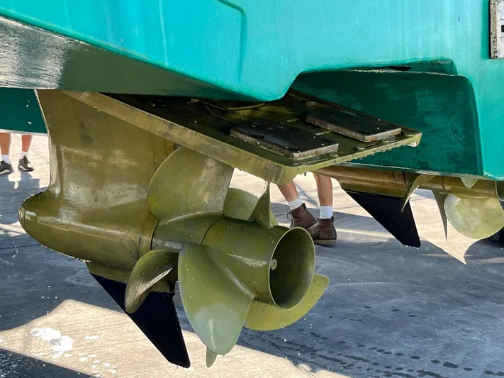 We''ll Sea Yacht Photos Pics Close-up of 2011 Sabre 40 Sedan boat propellers on dry dock.