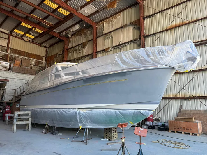 We''ll Sea Yacht Photos Pics 2011 Sabre 40 Sedan yacht in a warehouse, covered for maintenance.