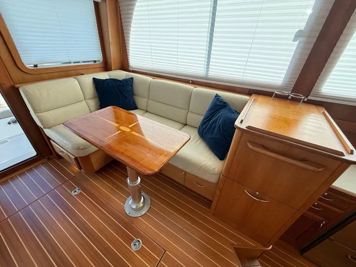 We''ll Sea Yacht Photos Pics Interior of 2011 Sabre 40 Sedan with wood flooring and beige seating.