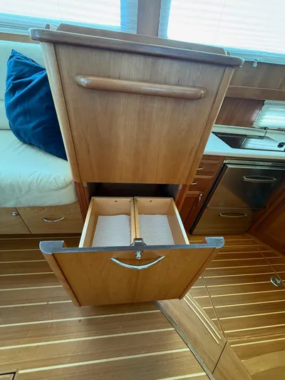 We''ll Sea Yacht Photos Pics Wooden drawer in 2011 Sabre 40 Sedan yacht interior, showcasing elegant design and functionality.