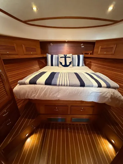 We''ll Sea Yacht Photos Pics Luxurious cabin interior of 2011 Sabre 40 Sedan yacht with nautical-themed bedding.