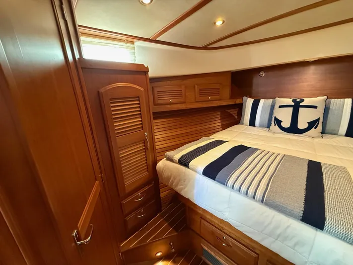 We''ll Sea Yacht Photos Pics Luxurious cabin interior of 2011 Sabre 40 Sedan with nautical-themed bedding.