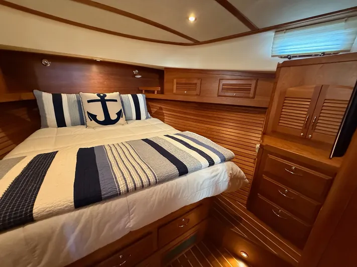 We''ll Sea Yacht Photos Pics Luxurious cabin interior of 2011 Sabre 40 Sedan with nautical-themed bedding.