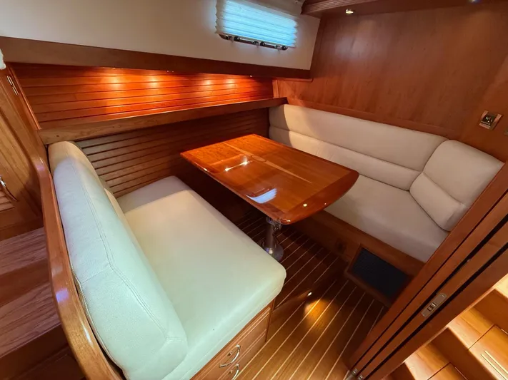 We''ll Sea Yacht Photos Pics Luxurious interior of 2011 Sabre 40 Sedan with elegant wood finish and cozy seating.