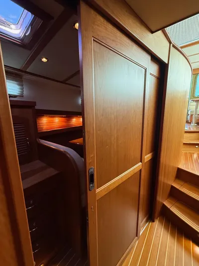 We''ll Sea Yacht Photos Pics Interior of 2011 Sabre 40 Sedan yacht with wooden sliding door and steps.