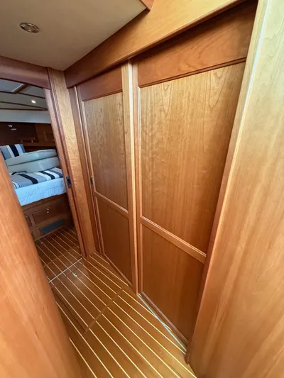 We''ll Sea Yacht Photos Pics Interior of 2011 Sabre 40 Sedan yacht with wooden paneling and flooring.