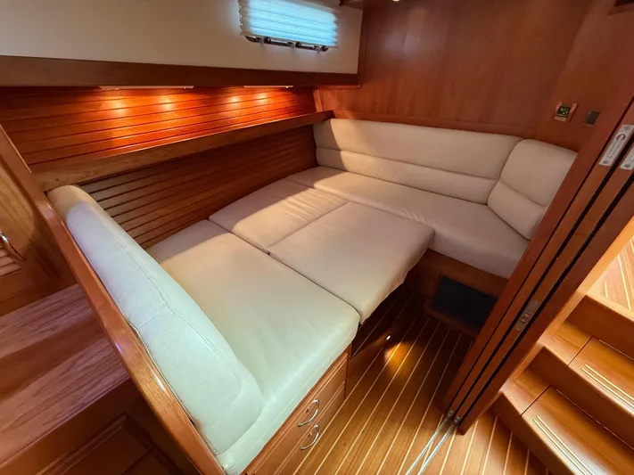 We''ll Sea Yacht Photos Pics 2011 Sabre 40 Sedan interior with cozy leather seating and warm wood paneling.