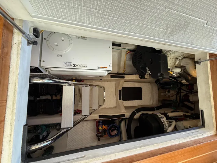 We''ll Sea Yacht Photos Pics Engine compartment of a 2011 Sabre 40 Sedan boat, showcasing mechanical components.