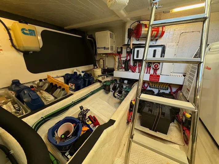 We''ll Sea Yacht Photos Pics Engine room of a 2011 Sabre 40 Sedan with tools and equipment neatly organized.