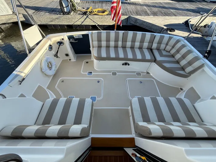 We''ll Sea Yacht Photos Pics 2011 Sabre 40 Sedan boat interior with striped seating and spacious deck area.